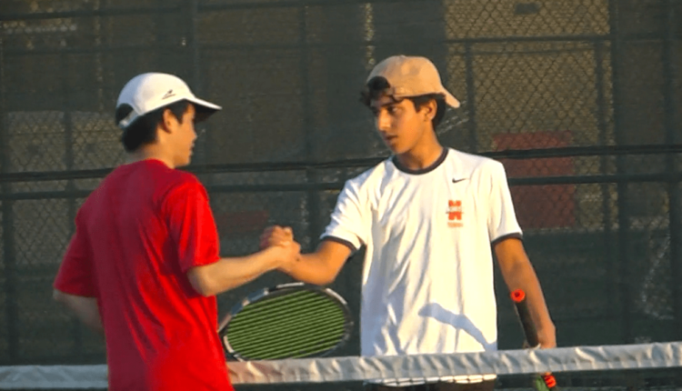 Aarush-Bhardwaj-shaking-hands-with-Daniel-Wu.png
